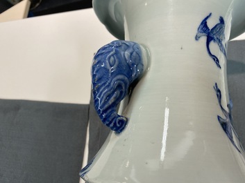 A Chinese blue, white and copper red vase with elephant handles, 19th C.